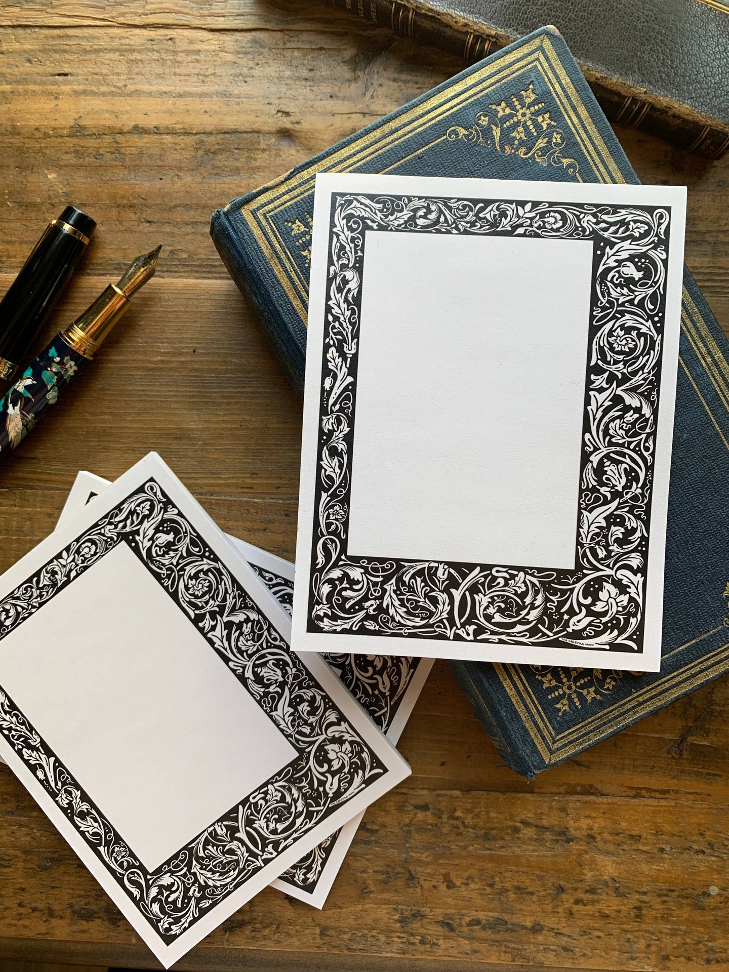 Black and White Floral Border Notepad by The Creeping Moon