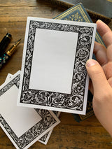 Black and White Floral Border Notepad by The Creeping Moon