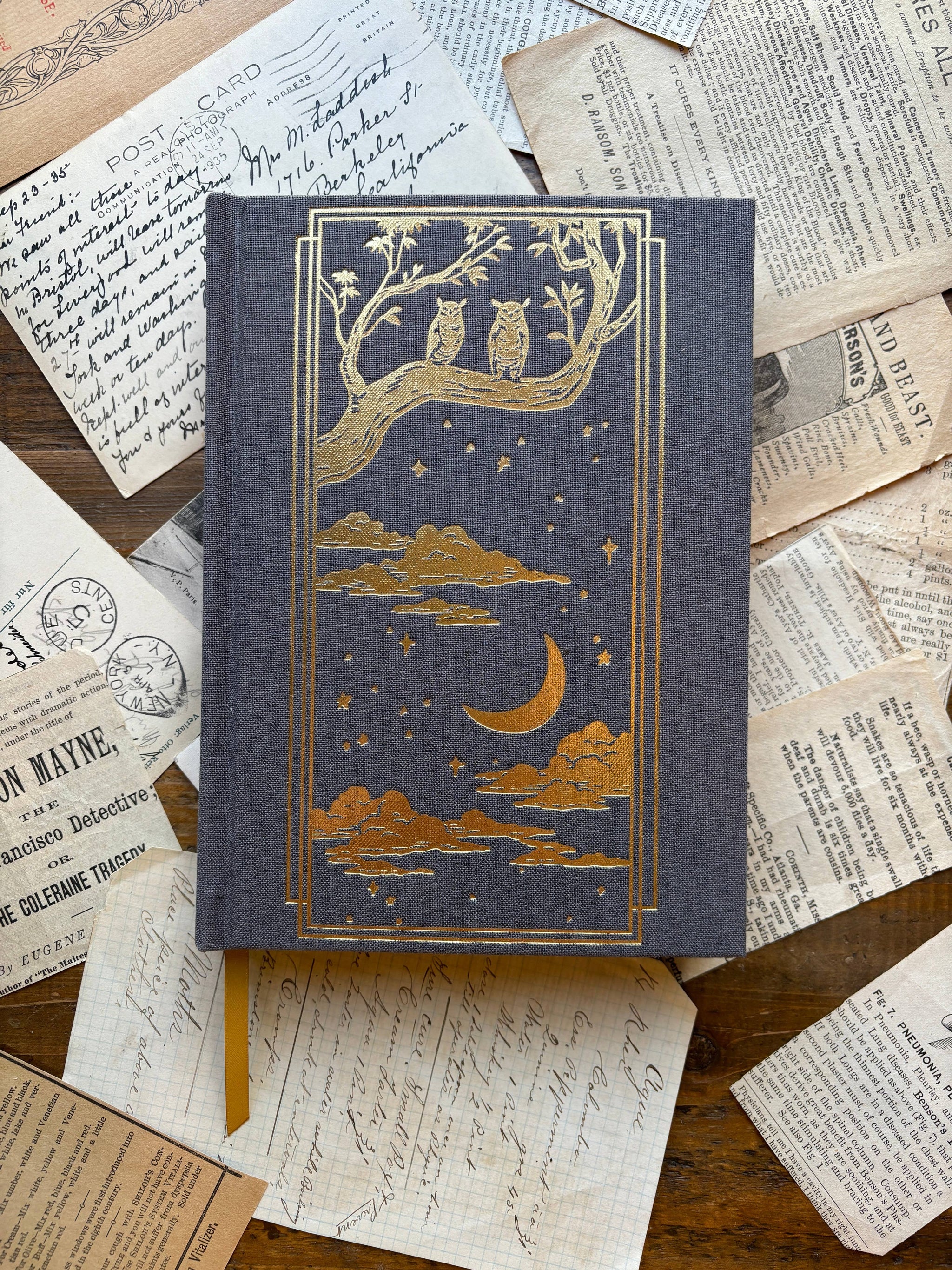 The Oracle Antiquarian Black Paper Notebook by The Creeping Moon