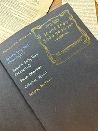 The Oracle Antiquarian Black Paper Notebook by The Creeping Moon